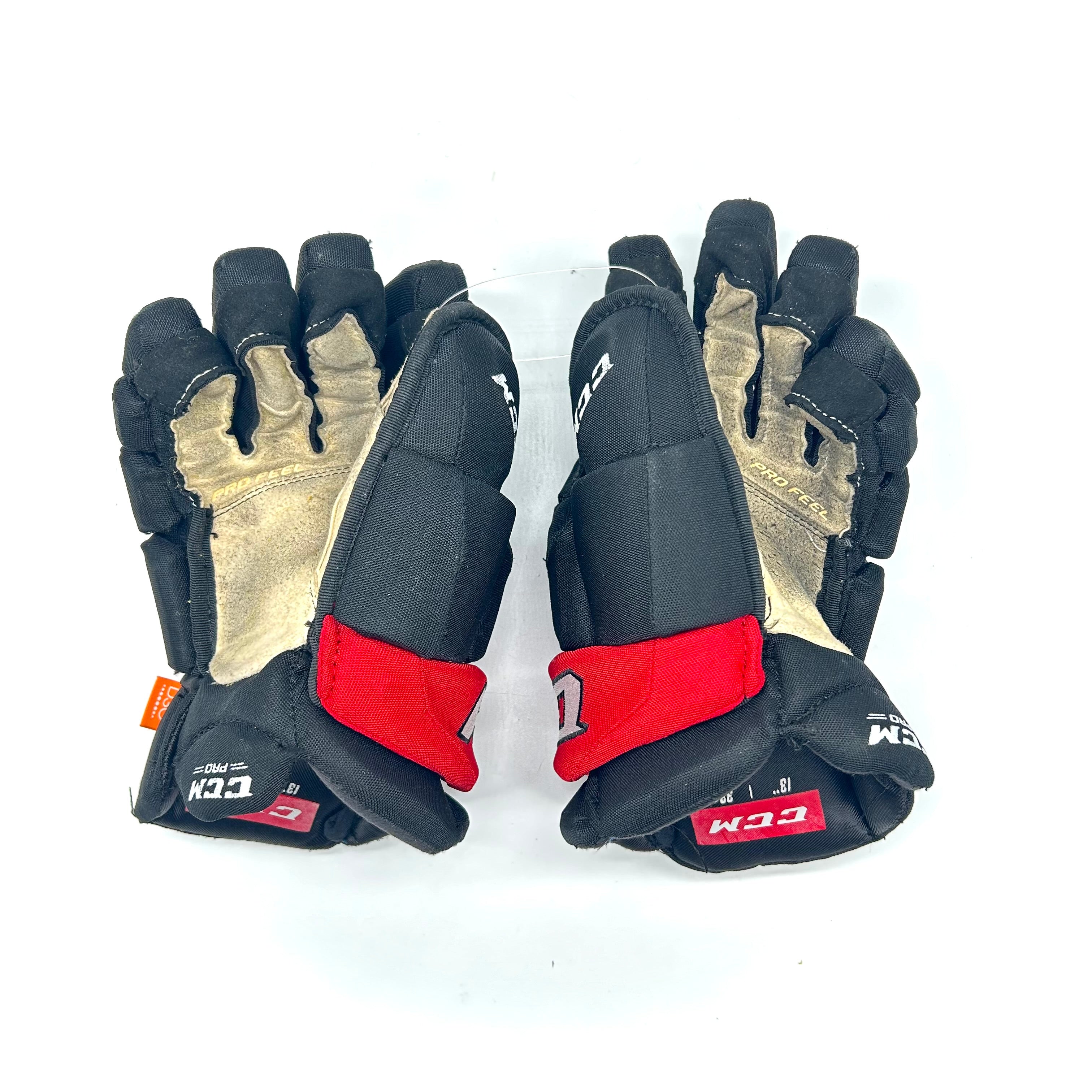 CCM HGJS - Gants Pro Stock d'occasion (noir/rouge)